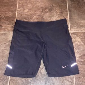 Black Nike running shorts with zipper on the back